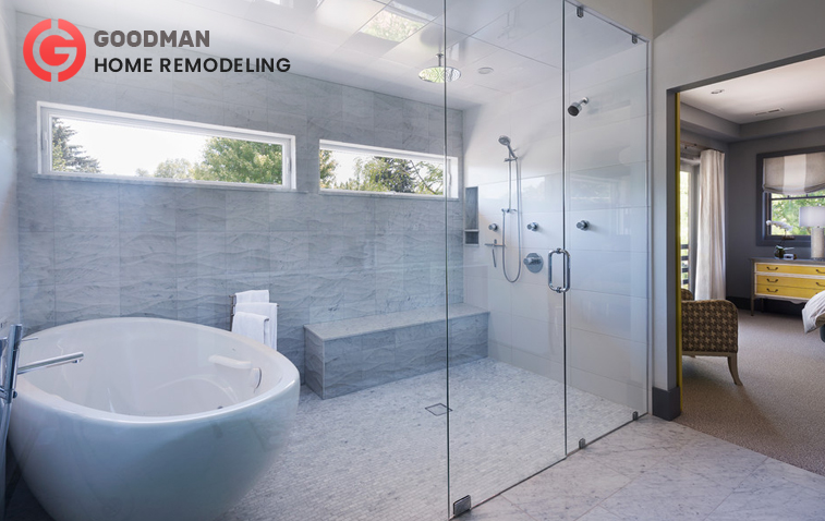 Modern bathroom featuring a spacious shower enclosure and an oval-shaped bathtub.